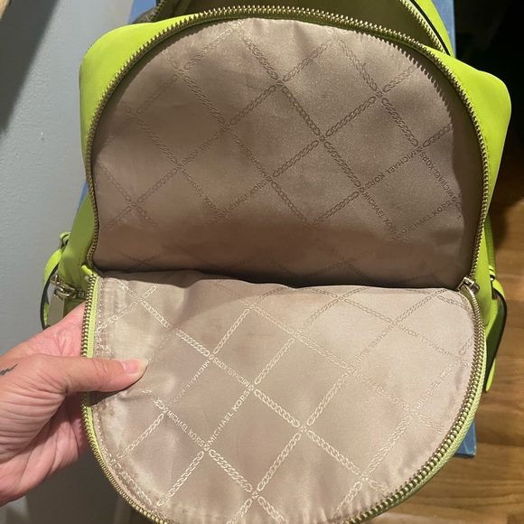 Gently used in excellent condition Michael Kors neon green back pack purse. - Picture 7 of 8